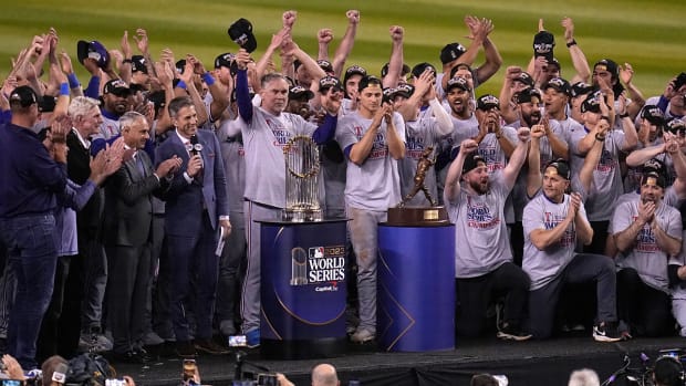 Rangers celebrate after winning Game 5 of the baseball World Series against the Diamondbacks.